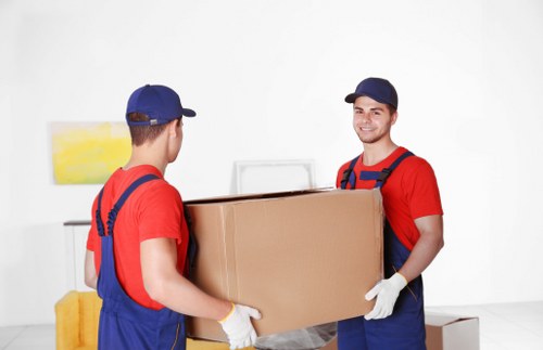Removal team planning a house move in Shoreditch with boxes and furniture