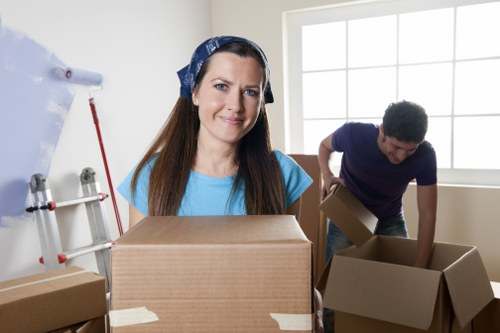 Packed moving boxes and furniture ready for local removal service