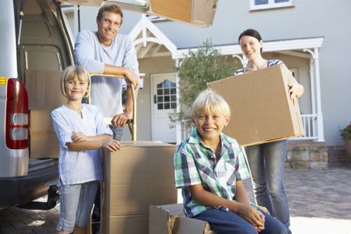 House removalists carrying furniture from a Shoreditch flat