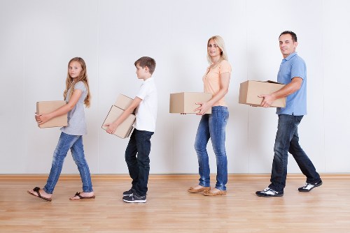 Careful wrapping of fragile household items during a packing service in Shoreditch